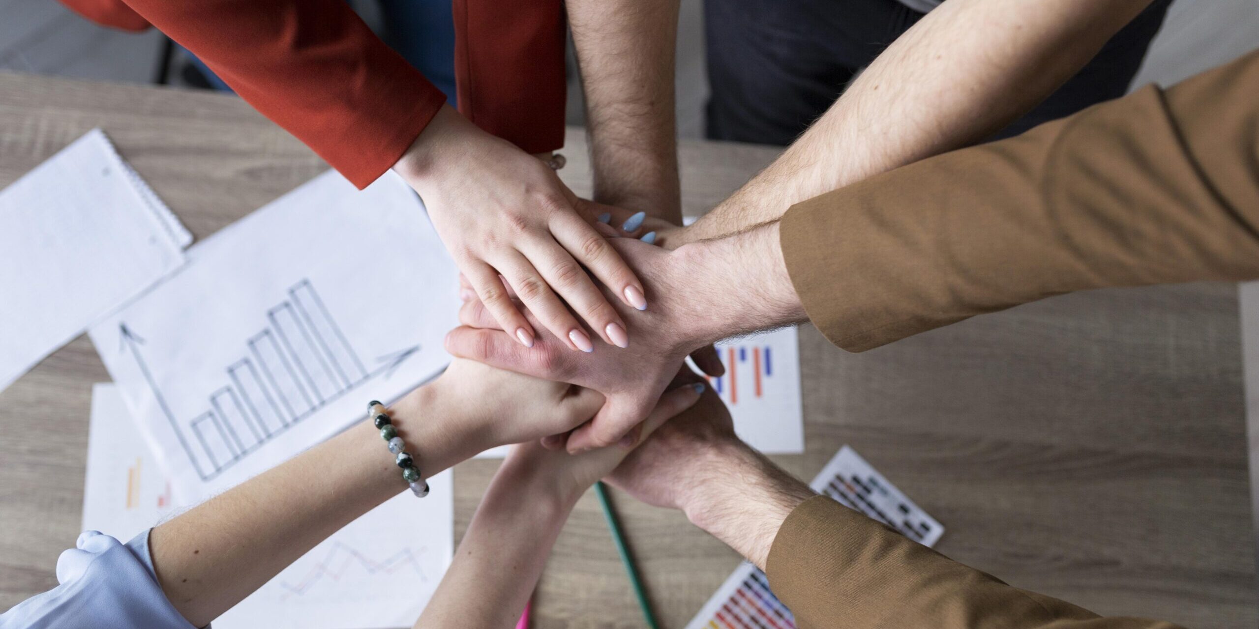 group-coworkers-putting-their-hands-together